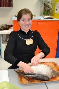 Madame Curie (Rebecca Cheek) prepares a goose